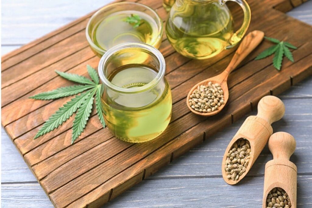 Hemp seeds, oil and marijuana leaf