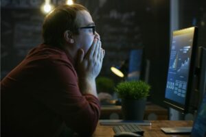 Stressed worker at computer